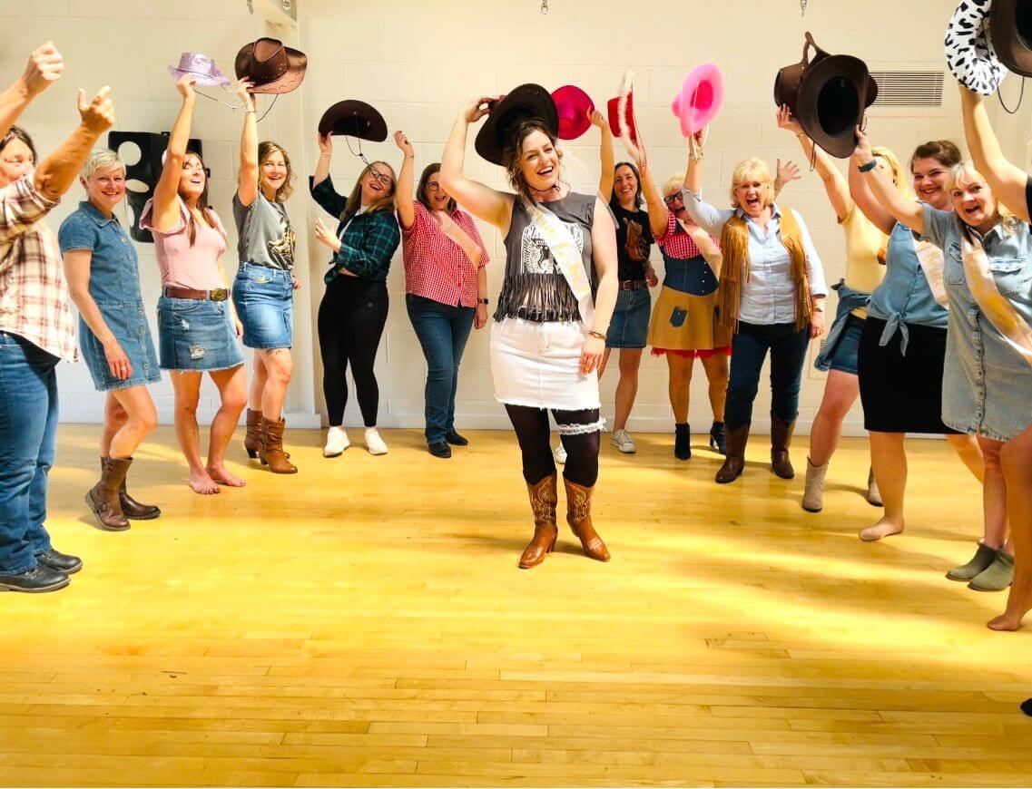 Line dancing classes Milton Keynes - enthusiastic group learning country line dance moves in Britain's largest new town